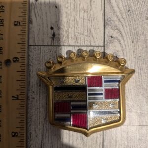Cadillac Gold and Red Emblem